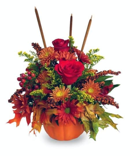 Pumpkin spice and everything nice! This arrangement is a spicy explosion of fall flowers like roses, mums, daisies, and accents in a keepsake ceramic pumpkin container.